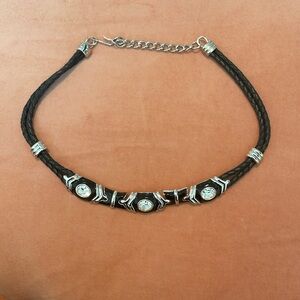 Nolan Miller necklace. Adjustable length. Black rope like w/diamond accents.